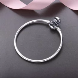 Srebrna bransoletka bangle Moments z zapięciem z płatkiem śniegu - 590740CZ - Bransoletki PANDORA